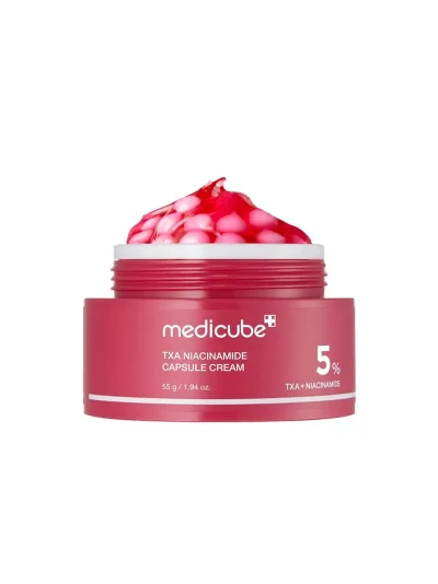 A professional shot of TXA Niacinamide Capsule Cream 5% jar showing the unique pink capsule texture for after-spot care and skin brightening.