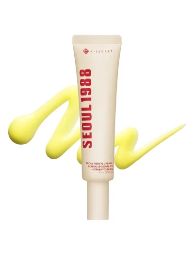 A professional shot of 1988 Eye Cream and its packaging, featuring Retinal Liposome 4% and Fermented Bean for advanced eye area care.